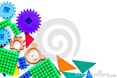 Educational toys for children mockup. Plastic blocks and clacks on white background top view copy space Stock Photo