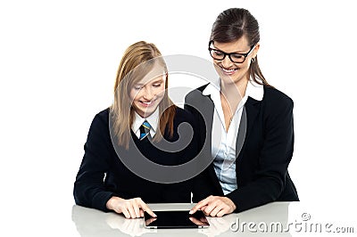 Educator and student exploring a tablet device Stock Photo