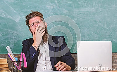 Educators more stressed at work than average people. High level fatigue. Educator bearded man yawning face tired at work Stock Photo