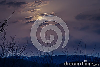 Eerie dark sky with bright moon Stock Photo