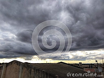 Eerie Elegance: Dramatic Black Clouds Gathering in the Sky Stock Photo