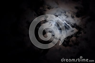 Eerie white clouds at night Stock Photo