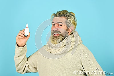 Effective nasal spray. Runny nose and other symptoms of cold. coronavirus from china. man use effective medicines. happy Stock Photo