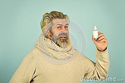 Effective nasal spray. Runny nose and other symptoms of cold. coronavirus from china. man use effective medicines. happy Stock Photo