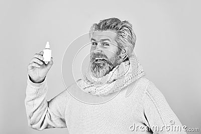 Effective nasal spray. Runny nose and other symptoms of cold. coronavirus from china. man use effective medicines. happy Stock Photo