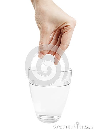 Effervescence tablet and a glass of water Stock Photo