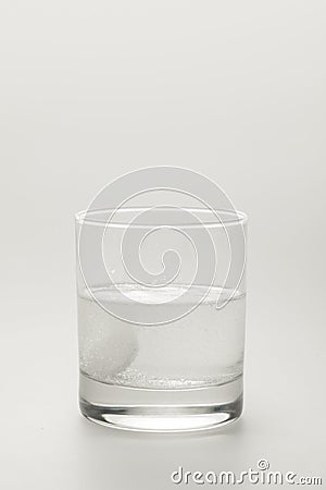 effervescent pill in glass of water Stock Photo