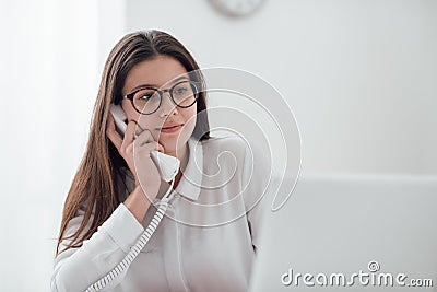 Efficient secretary on the phone Stock Photo