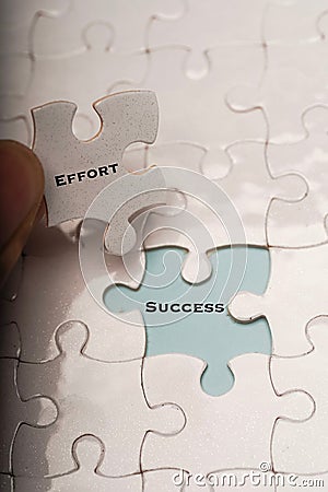 Effort and success wordings on puzzle pieces Stock Photo