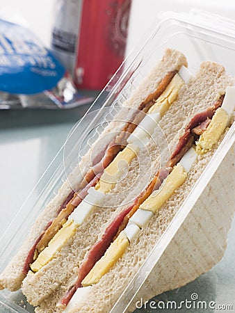 Egg And Bacon Sandwich On White Bread Stock Photo