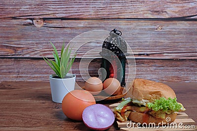 Egg burger, onion, eggs, tomato and lantern Stock Photo