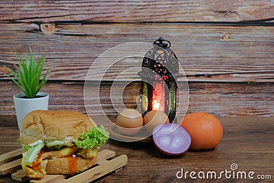 Egg burger, onion, eggs, tomato and lantern Stock Photo