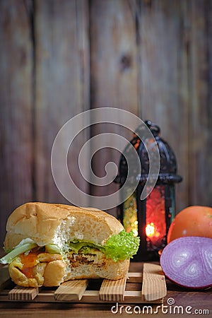 Egg burger, onion, eggs, tomato and lantern Stock Photo