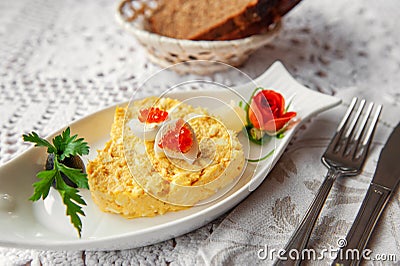Egg and cheese salad is decorated with quail eggs and caviar. Restaurant serving. Copy space. Selective focus Stock Photo