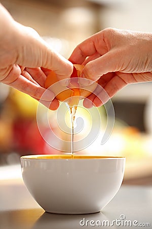 Egg cracking Stock Photo