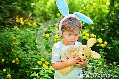 Egg hunt on spring holiday. Little boy child in green forest. love easter. Family holiday. Happy easter. Childhood Stock Photo