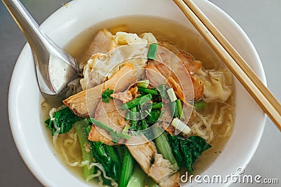 Egg noodle soup with red roast pork Stock Photo