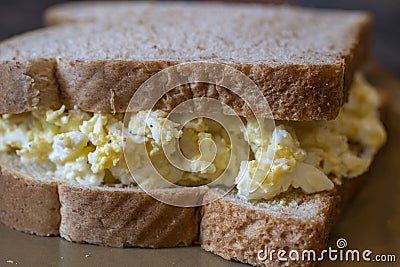 An egg salad sandwich on fresh bread ready to eat. Stock Photo