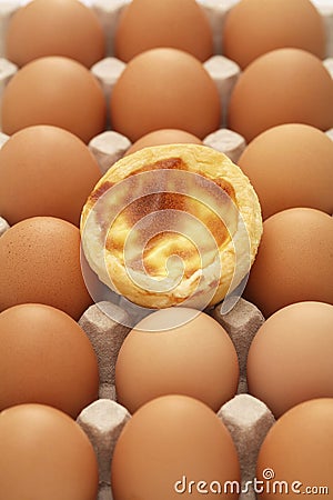 Egg tart and eggs. Conceptual image Stock Photo