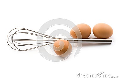 Eggbeater and eggs Stock Photo