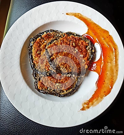 Eggplant Parmesan with tomato sauce Stock Photo