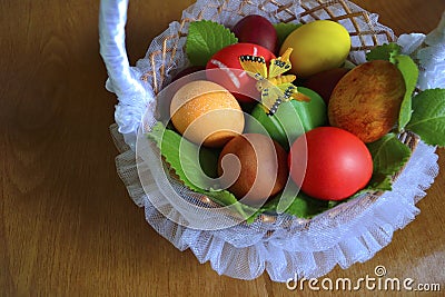 Eggs in a basket with butterfly Stock Photo
