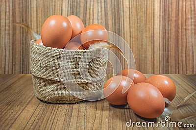 Eggs in basket on wood.eggs.egg.brown.rawfood Stock Photo