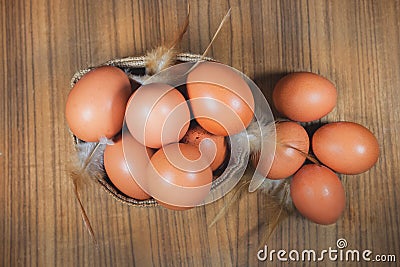 Eggs in basket on wood.eggs.egg.brown.rawfood Stock Photo