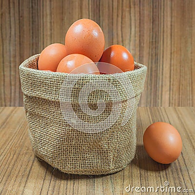 Eggs in basket on wood.eggs.egg.brown.rawfood Stock Photo