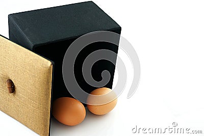 Eggs in black box Stock Photo