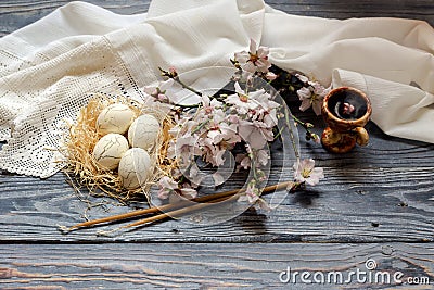 Eggs, censer with incense, the branches of flowering almonds Stock Photo