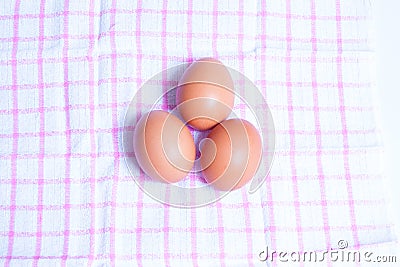 Eggs on the check cloth Stock Photo