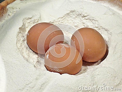 eggs on fresh flour Stock Photo