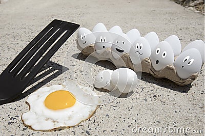 Eggs frying on sidewalk illustrated Stock Photo