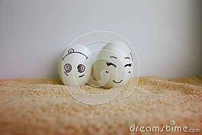 Eggs funny with faces concept is all upside down Stock Photo