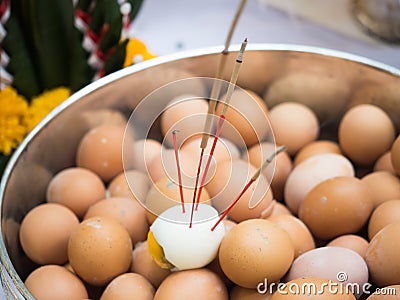 Eggs and incense offerings Stock Photo