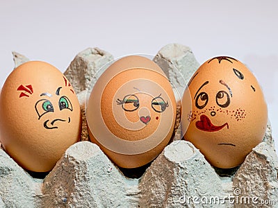 Eggs with painted faces. Photo for your design. Concept of joint Stock Photo