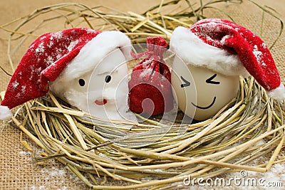 Eggs with persons in the nest for Christmas Stock Photo