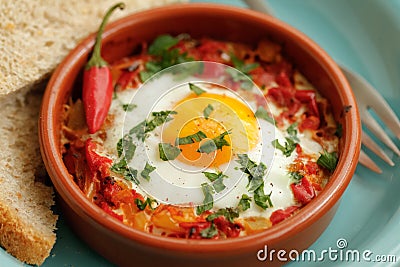 Eggs poached in tomato sauce Stock Photo