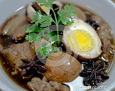 Eggs and pork in brown sauce frogs Stock Photo