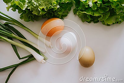 Eggs and salad and garlic leaf on the table Stock Photo