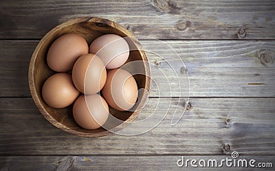 Eggs in a wooden bowl Stock Photo