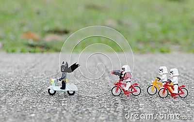 Ego starwars troopers riding bicycle chasing lego batman Editorial Stock Photo