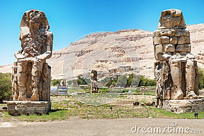 The Colossi of Memnon - two massive stone statues of Pharaoh Amenhotep III Stock Photo