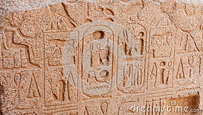 EGYPT, LUXOR - MARCH 01, 2019: ancient Egyptian hieroglyphs, drawings and inscriptions on the walls and columns in the temple of Editorial Stock Photo