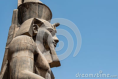 Egypt Luxor Temple. granite Statue of Ramesses II seated in front of columns Editorial Stock Photo