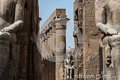 Egypt Luxor Temple. granite Statue of Ramesses II seated in front of columns Editorial Stock Photo