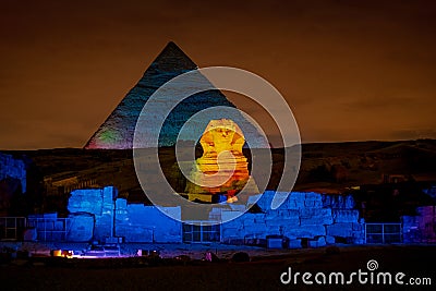 Egypt night at the Pyramids with the Sphinx illuminated Stock Photo