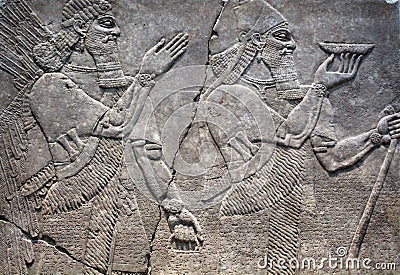 Egyptian figures on stone relief Stock Photo