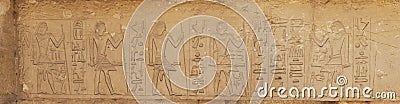 Egyptian images and hieroglyphs engraved on stone in the tomb near pyramid of Djoser in Saqqara Stock Photo